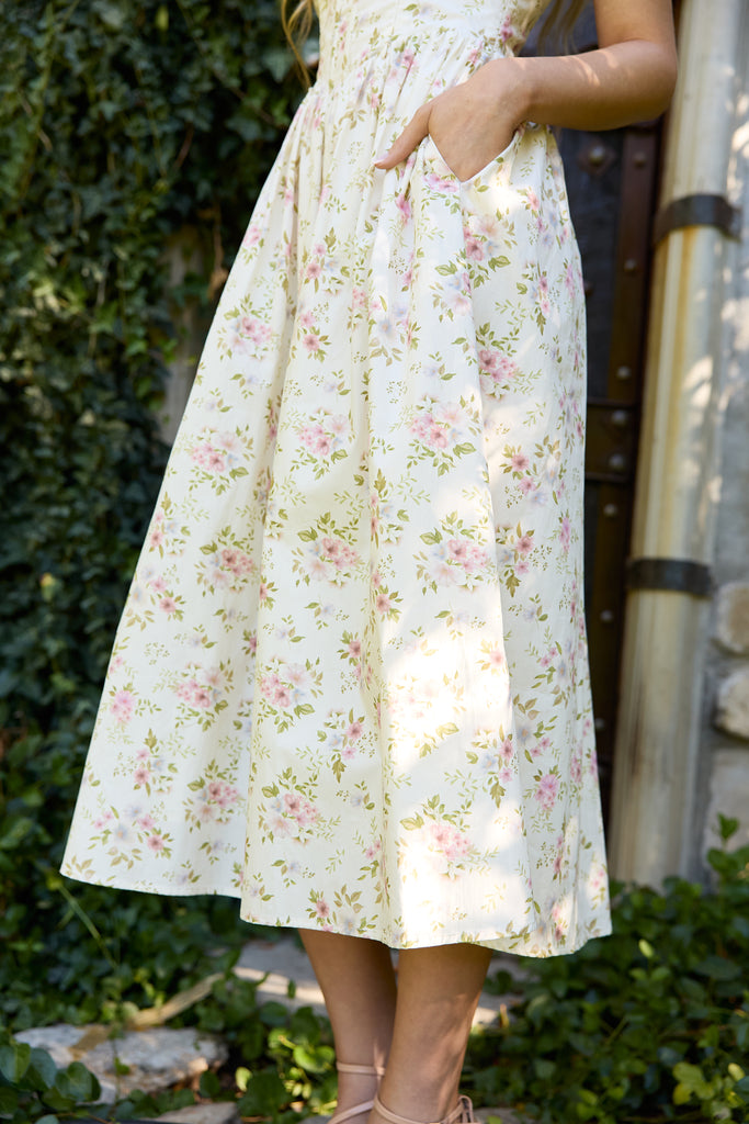 Person wearing a floral dress standing outdoors with greenery in the background - ribbed floral romantic midi dress summer spring garden party easter for women romantic date outfit